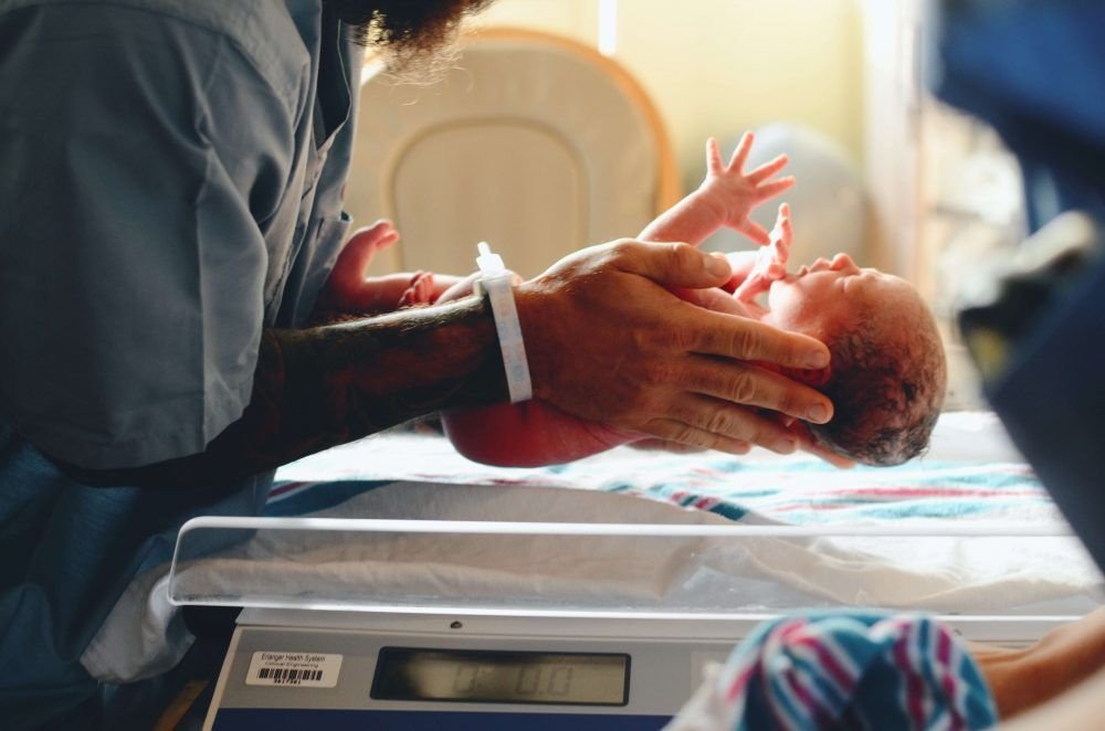 What is premature birth? Baby feet in an open incubator
